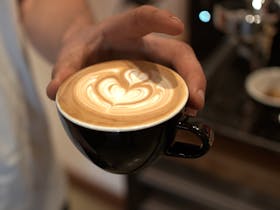 Latte Art in coffee cup ready to serve