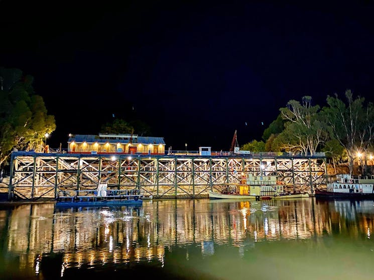 The historic Echuca Wharf viewed at night from the MV Mary Ann.