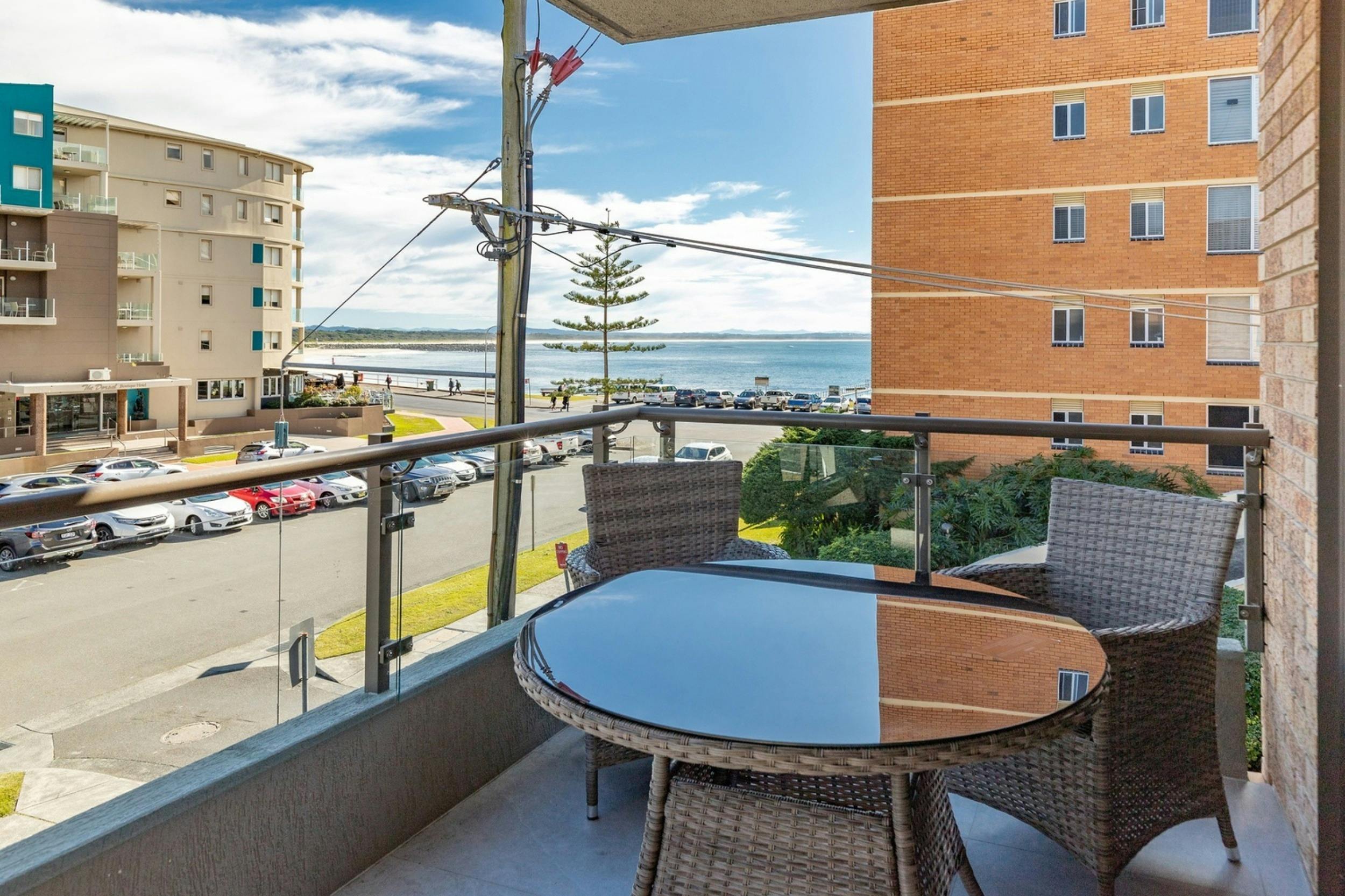 Balcony with ocean views and dining setting