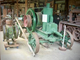 Stationary engines and wood shed, featuring artifacts from the local logging industry