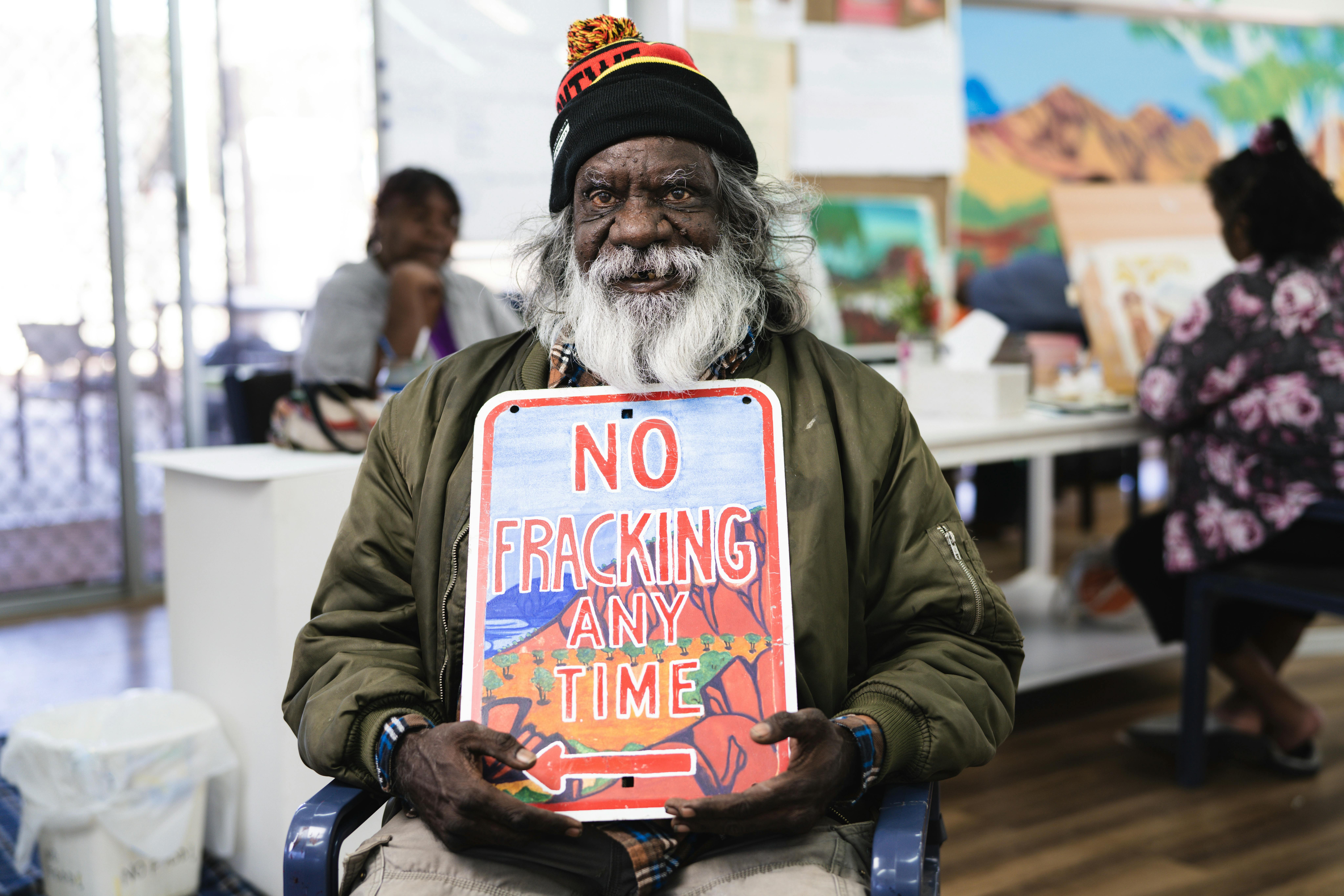 Artist Mervyn Rubuntja with political artwork