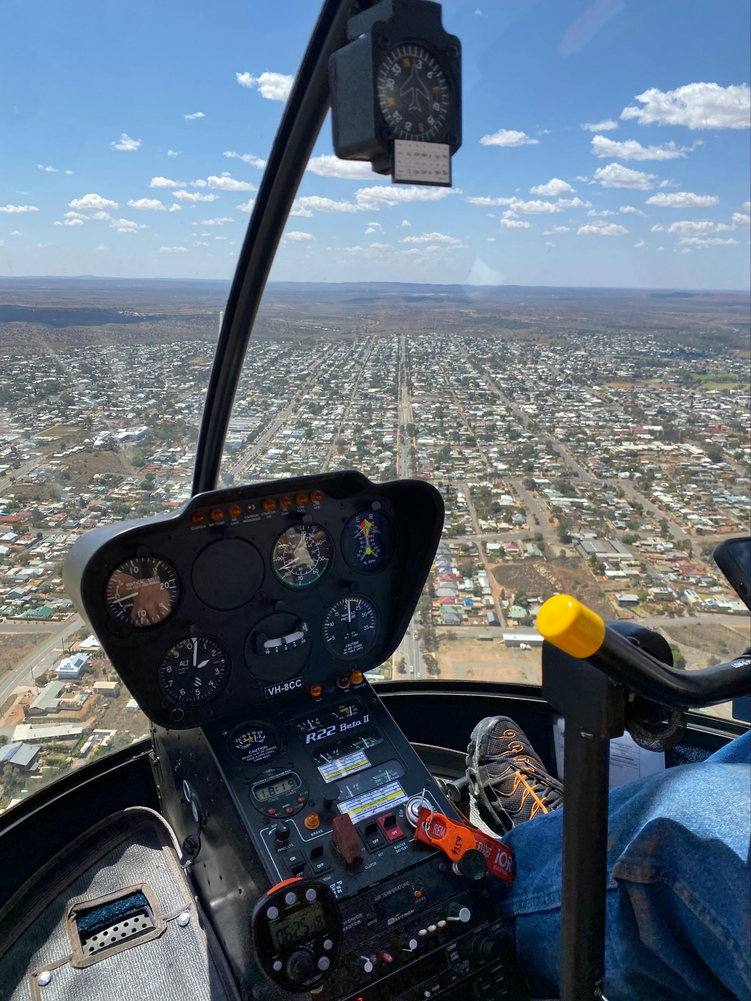 Aerial view of a town from helicopter cockpit
