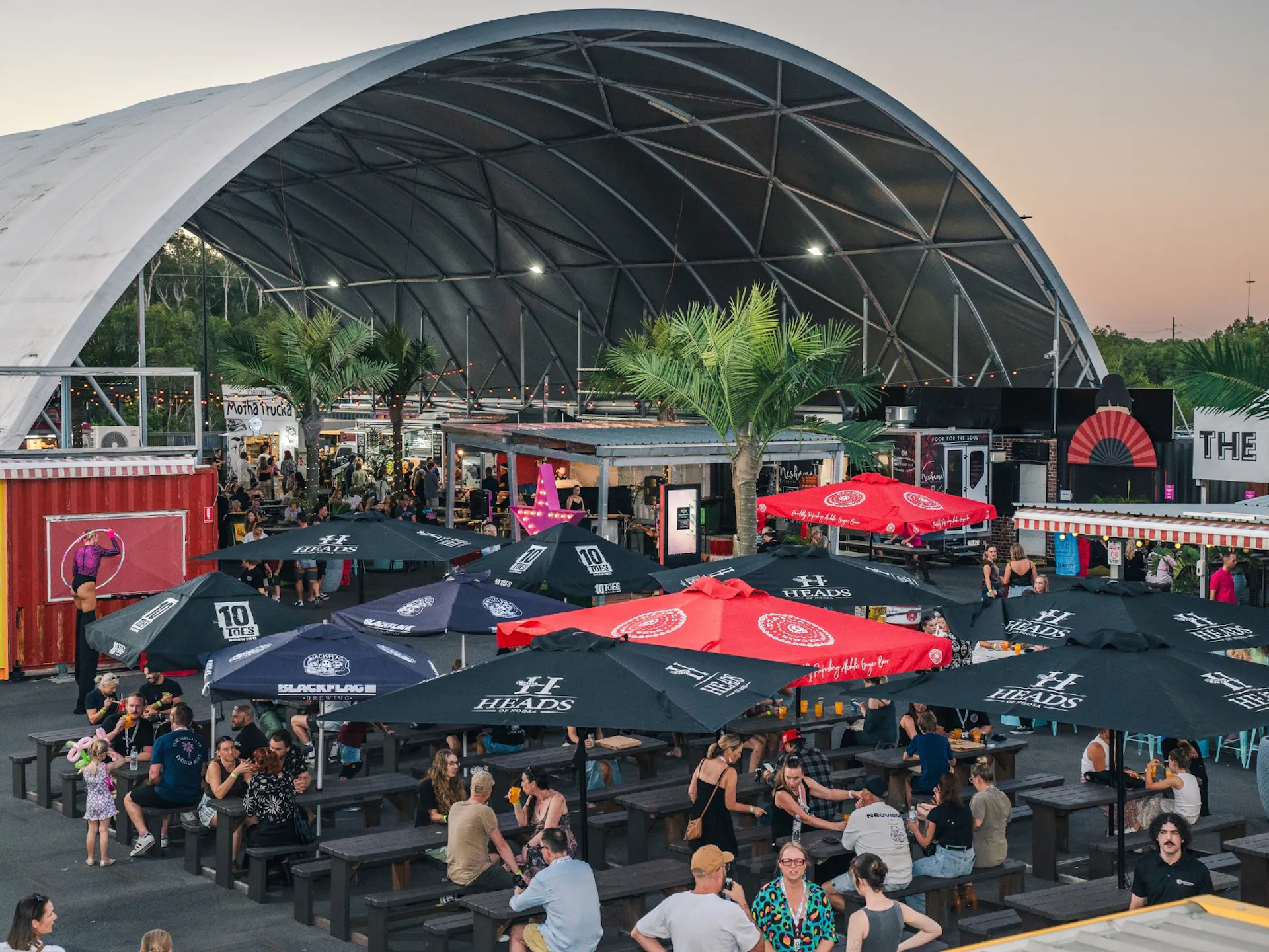 An image shot from above showing people sitting, drinking and eating at The Station.