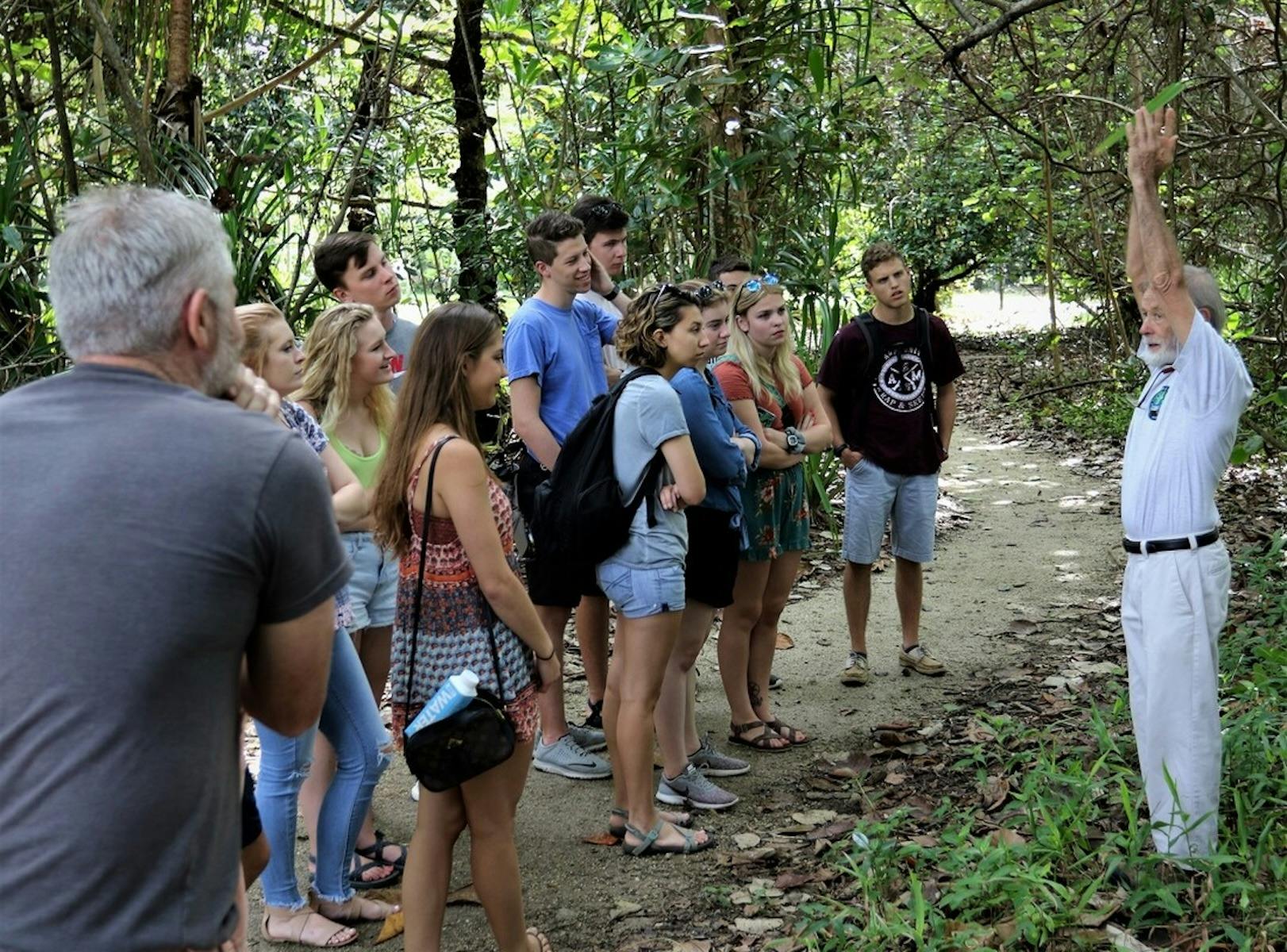 Group of visitors on a guided rainforest walk at C4 Environment Centre in Mission Beach