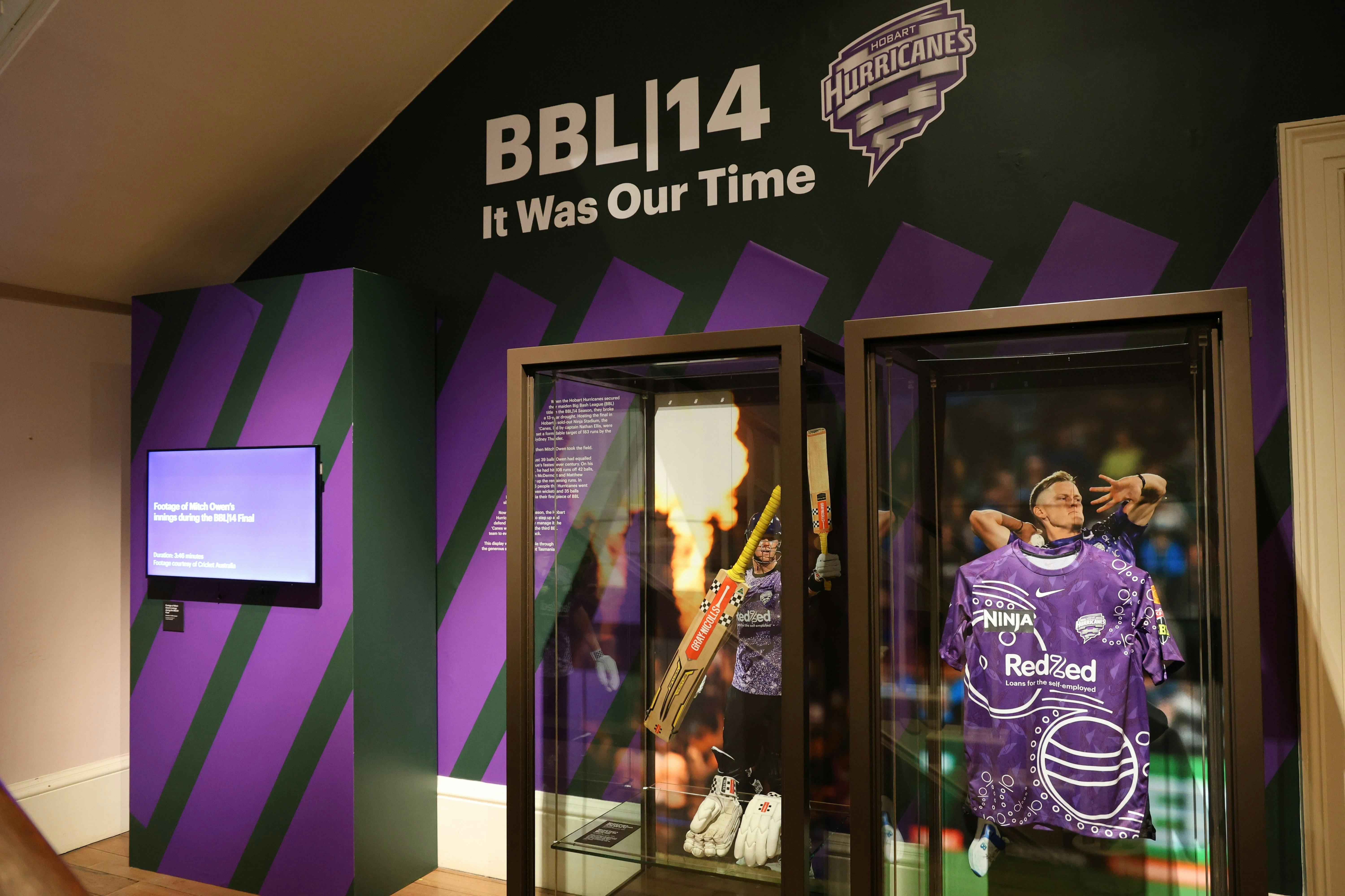 Display BBL|14 display featuring showcases with Captain Nathan Ellis' jersey and Mitchell Owens bat