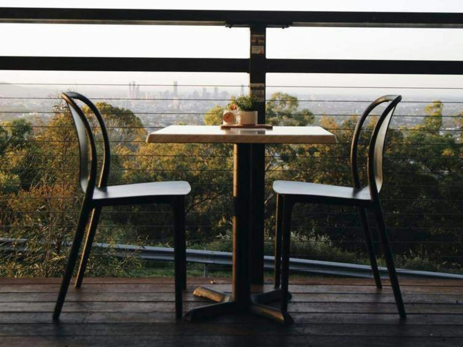 Chairs on the Lovewell Cafe Deck looking over Brisbane City Views Chairs on the Lovewell Cafe Deck looking over Brisbane City Views
