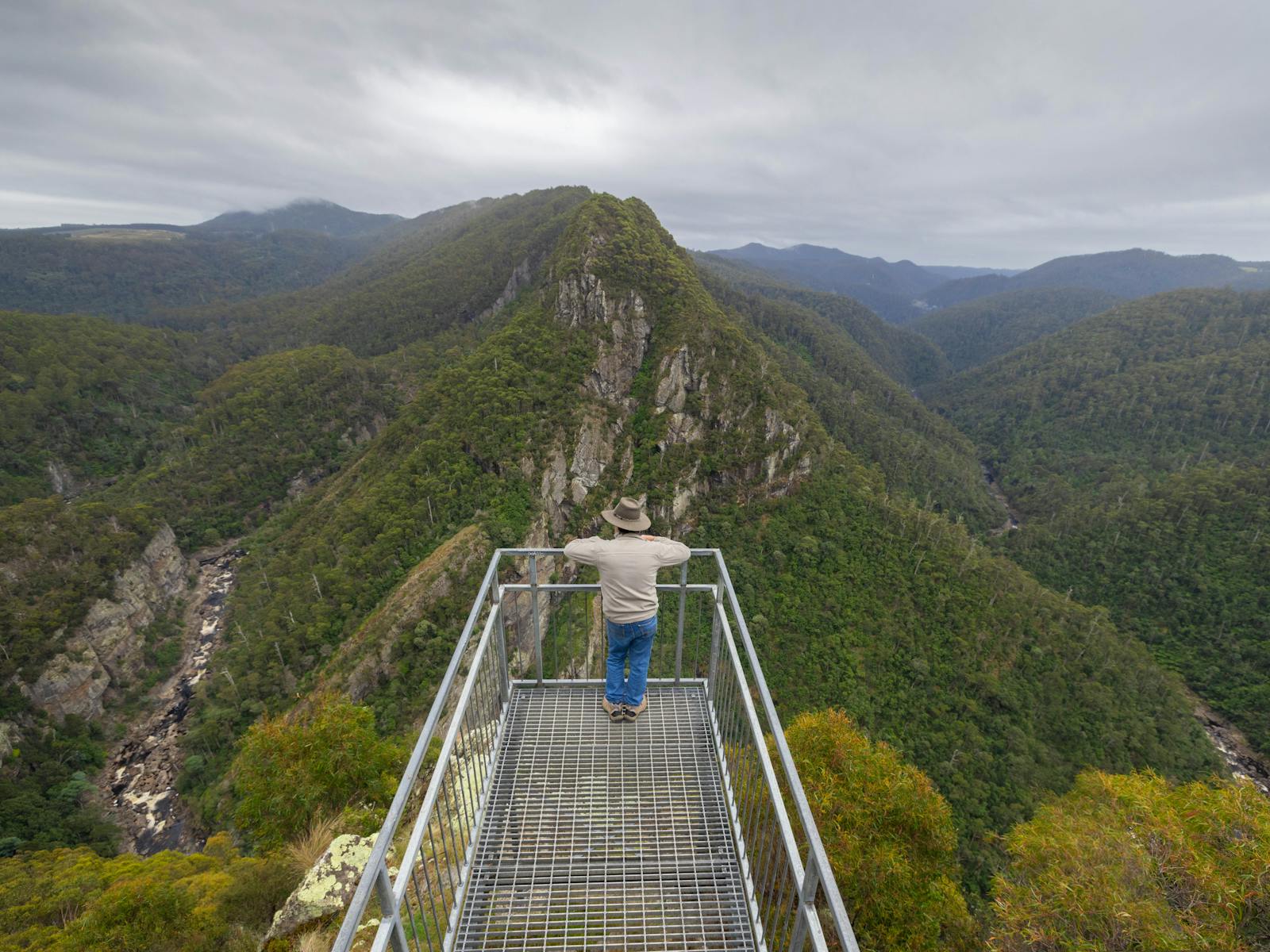 Man in hat at leven canyon lookout