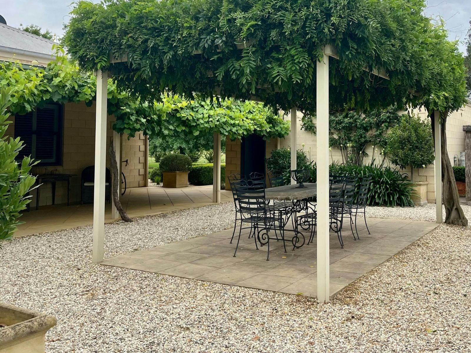 Wisteria Pergola with seating arrangement