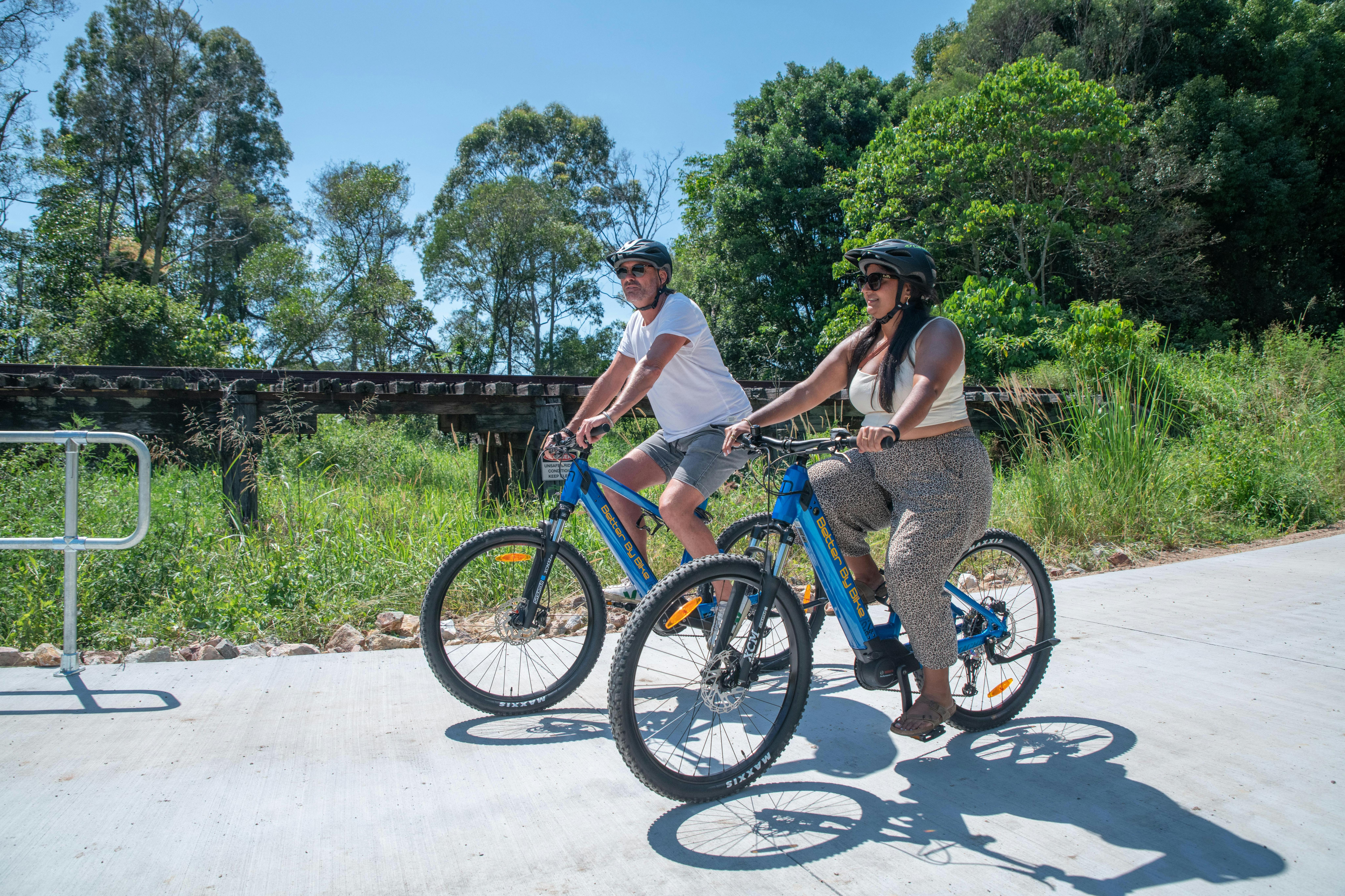 A couple out enjoying the sights and smells on the Northern Rivers Rail Trail with Better By Bike