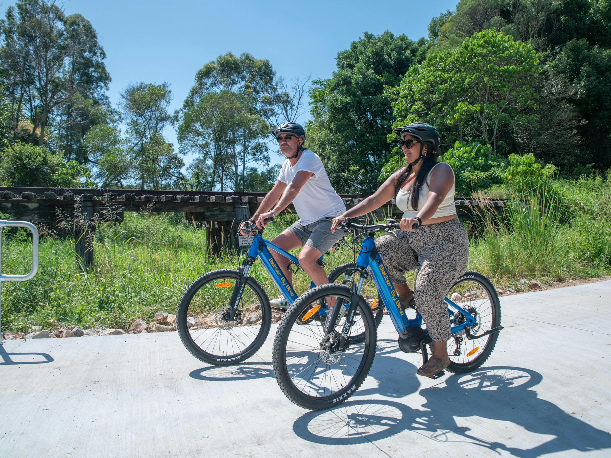 A couple out enjoying the sights and smells on the Northern Rivers Rail Trail with Better By Bike