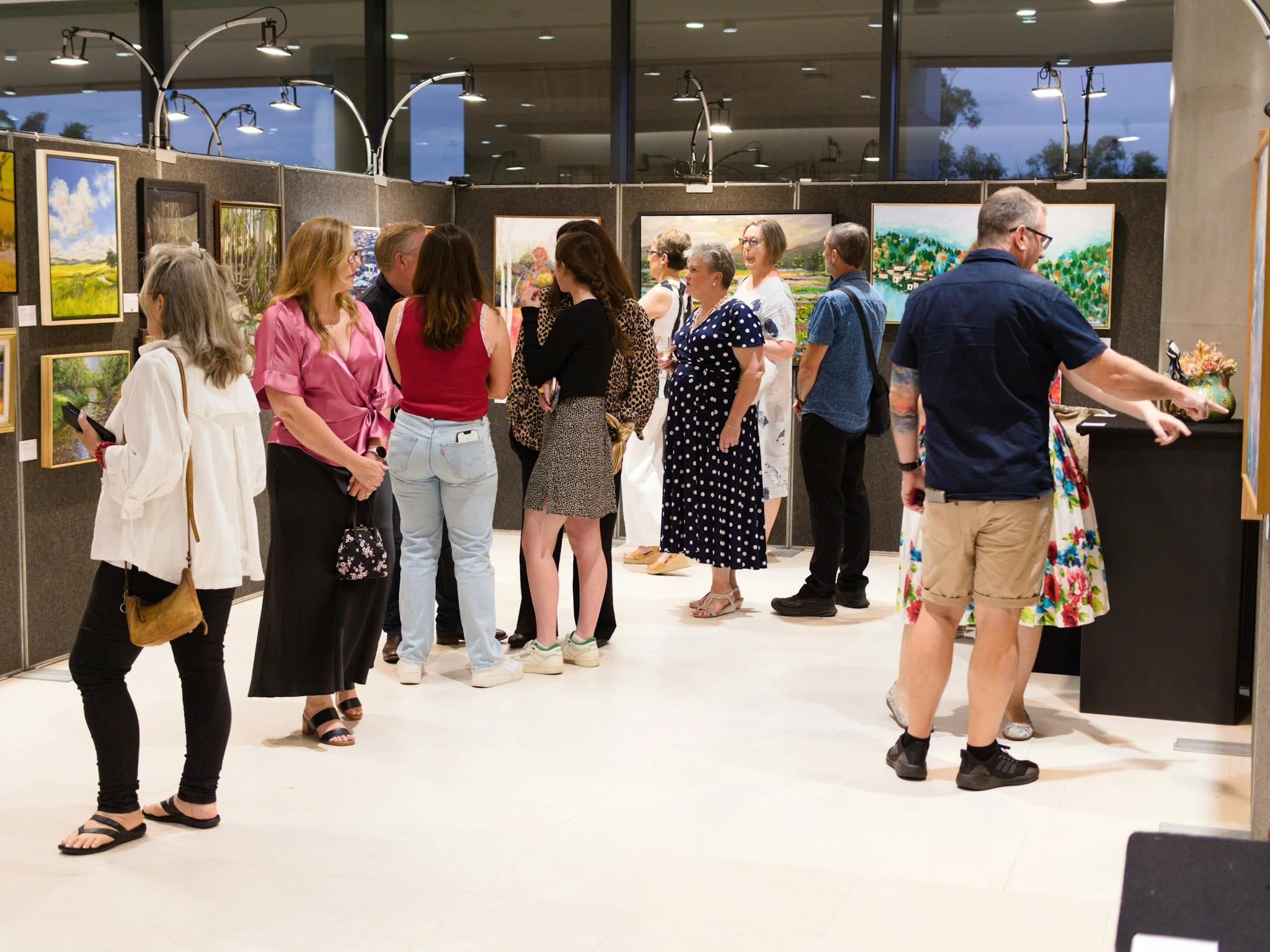 People looking at artworks People looking at artworks