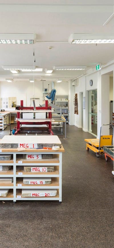 A room in the Megalo Print Studio with large work benches and equipment.