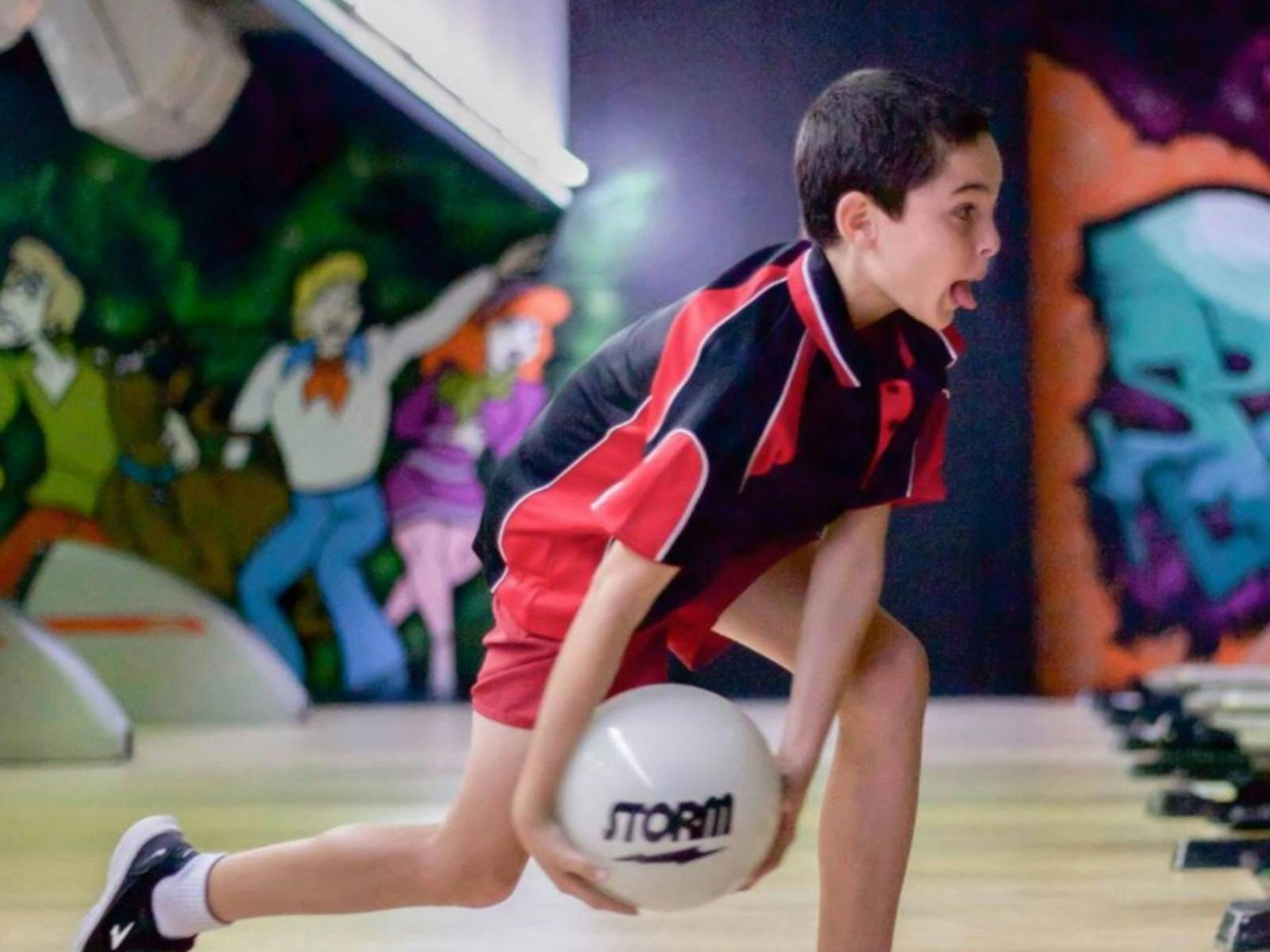 A kid bowling