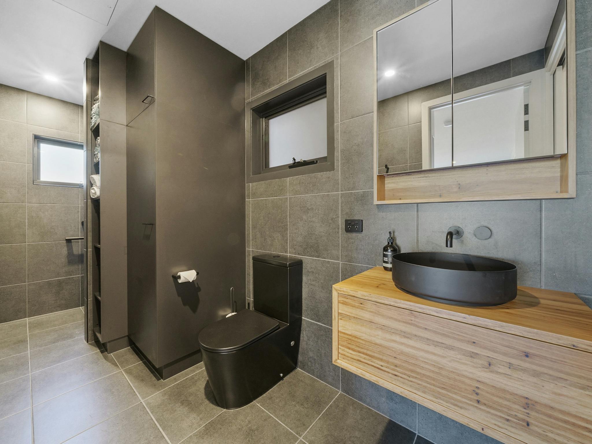 Bathroom with walk in and out shower, total luxury. European Laundry, washing machine and dryer.