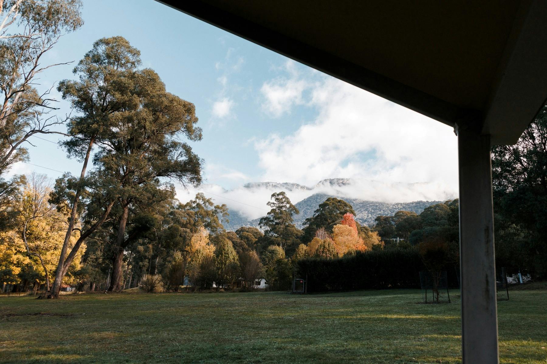 View of Mount Buffalo from the covered deck, blue sky and some light clouds