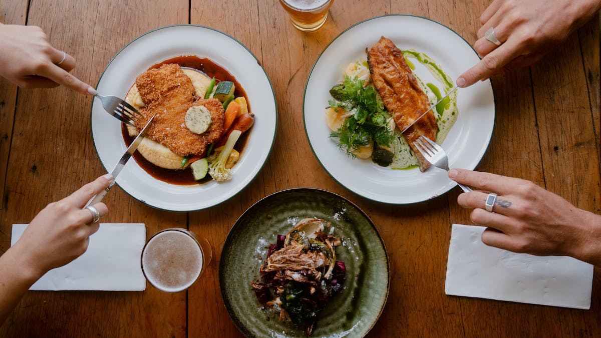 3 plated of food on a table 3 plated of food on a table