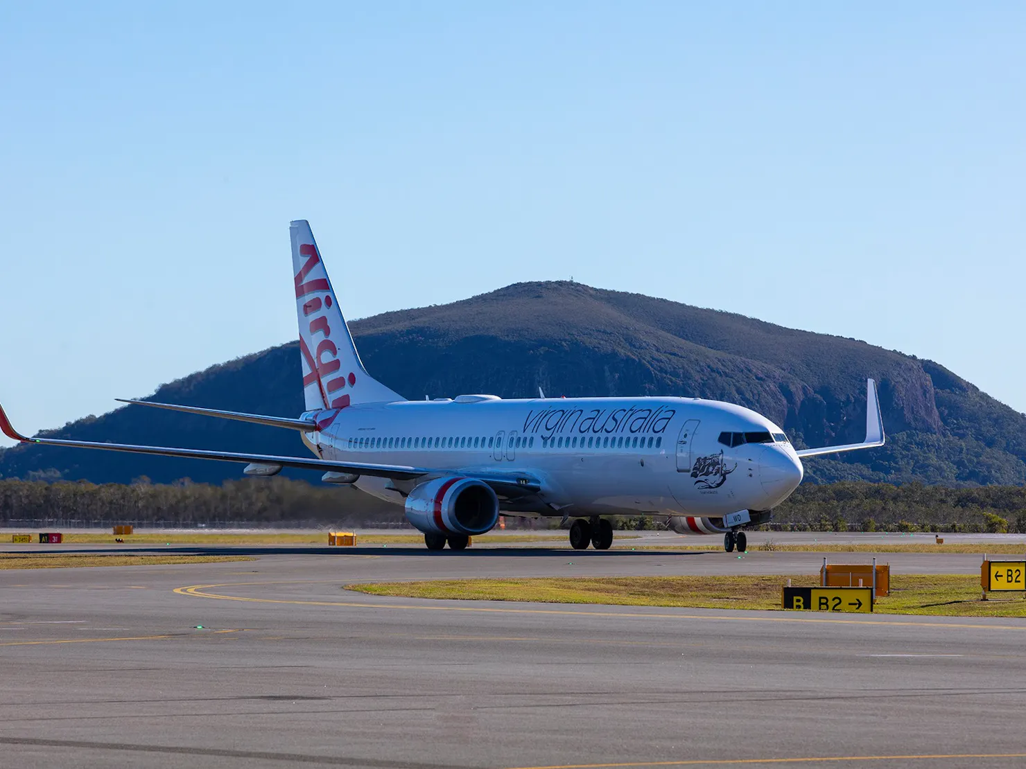 Virgin aircraft with Mount Coolum in the background.