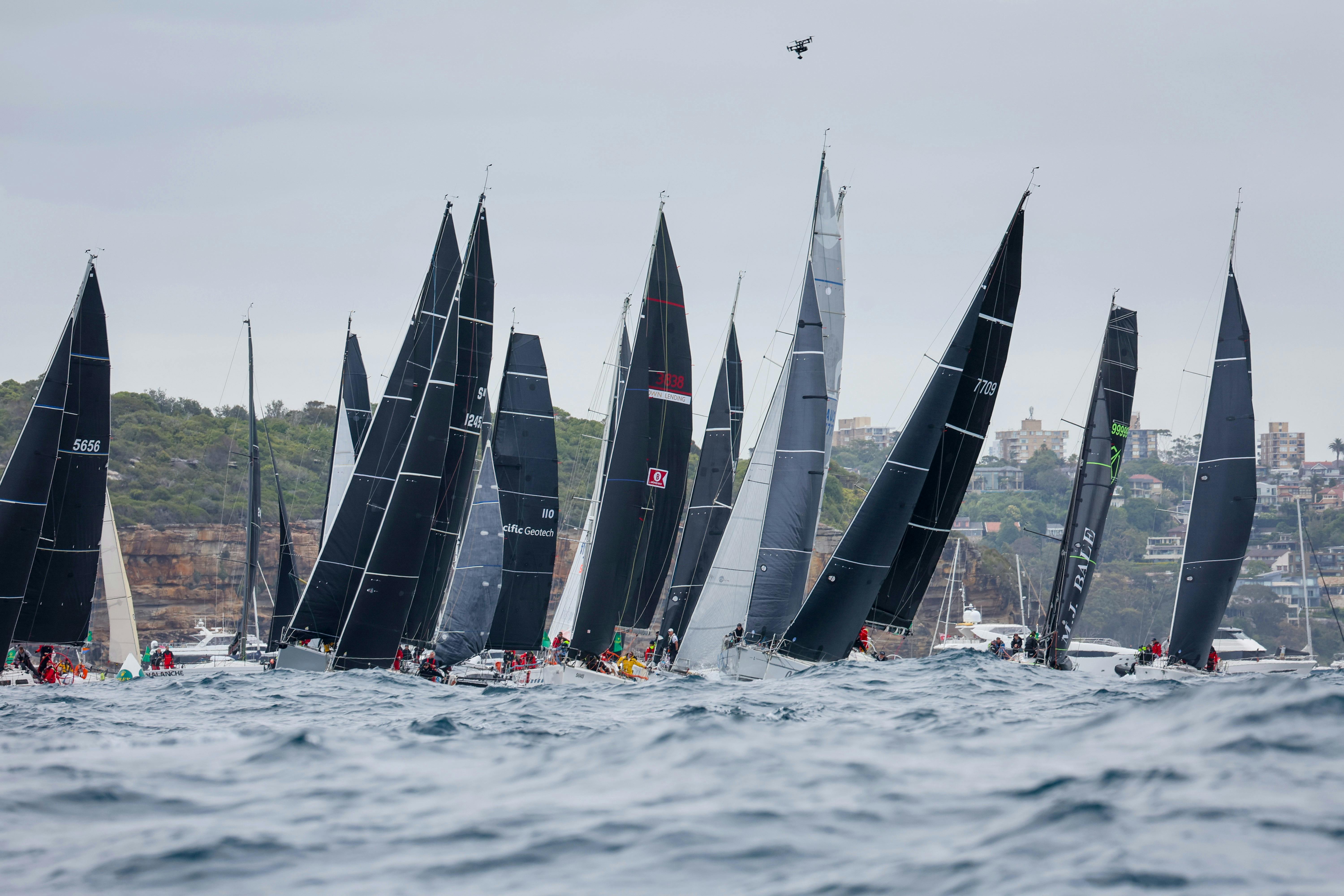 The fleet get's underway on Sydney Harbour to start the 2025 Rolex Sydney Hobart Yacht Race