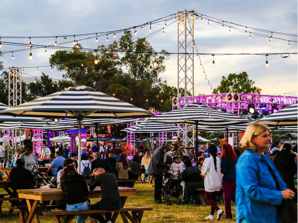 People enjoying food and drink in the Festival Hub