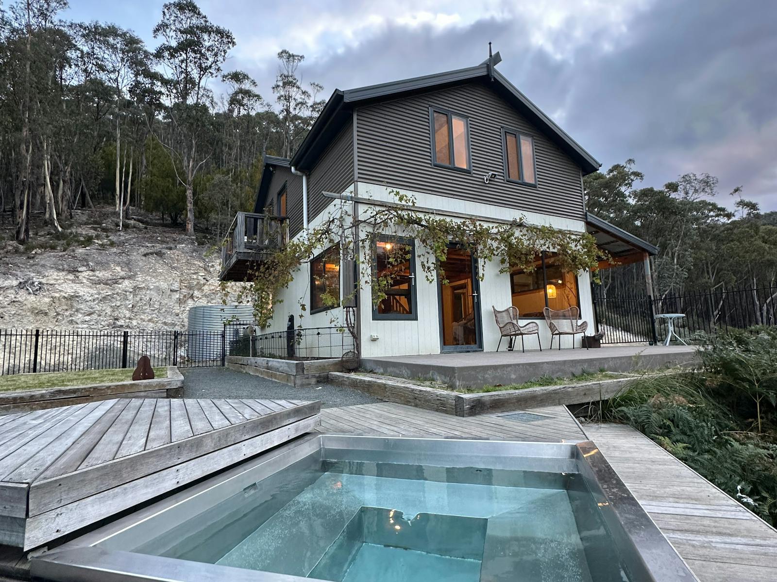The custom made thermal spa has a timber cover that slides back to reveal the constantly warm spa