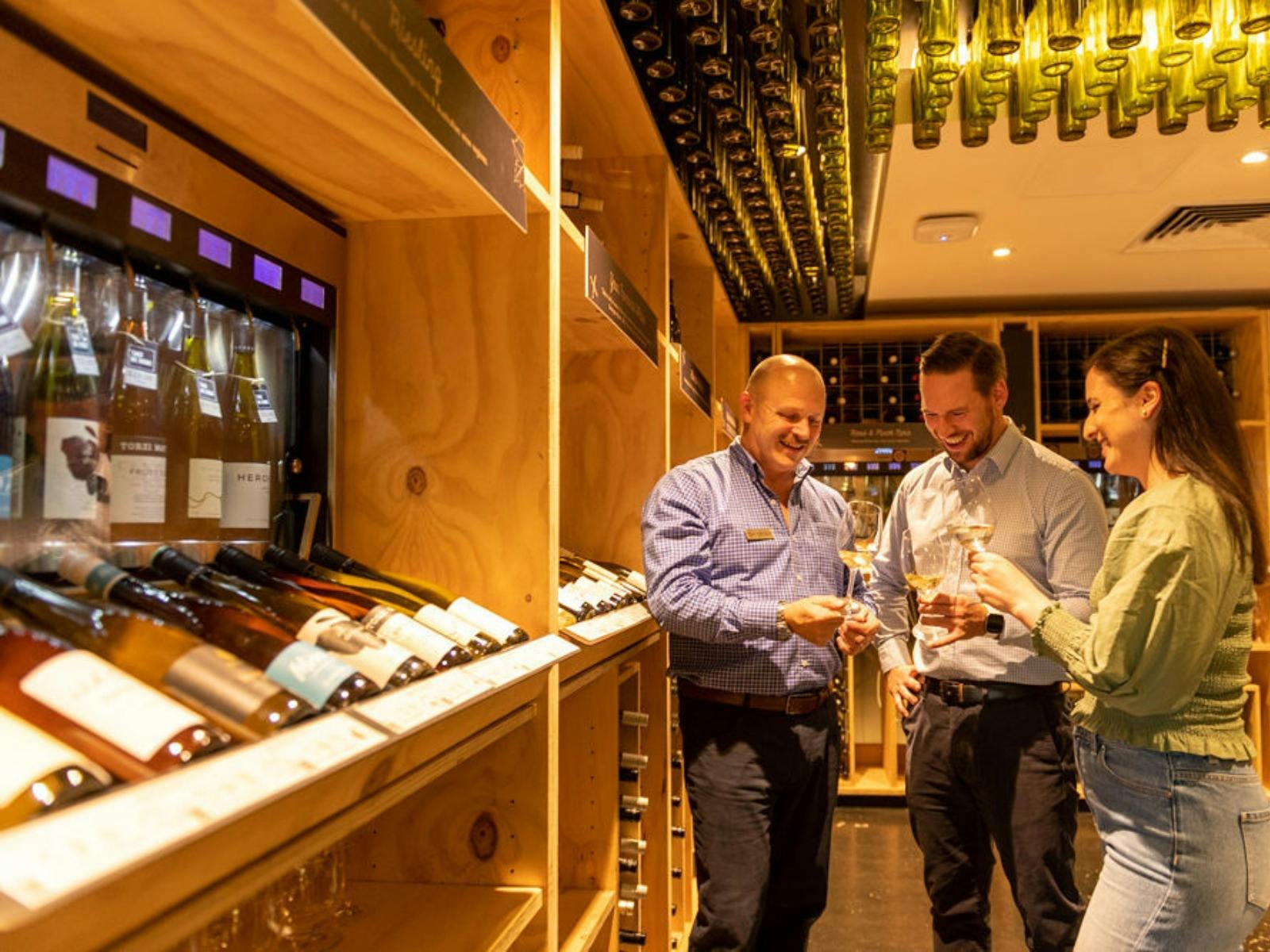 sommelier guiding guests through wine tasting