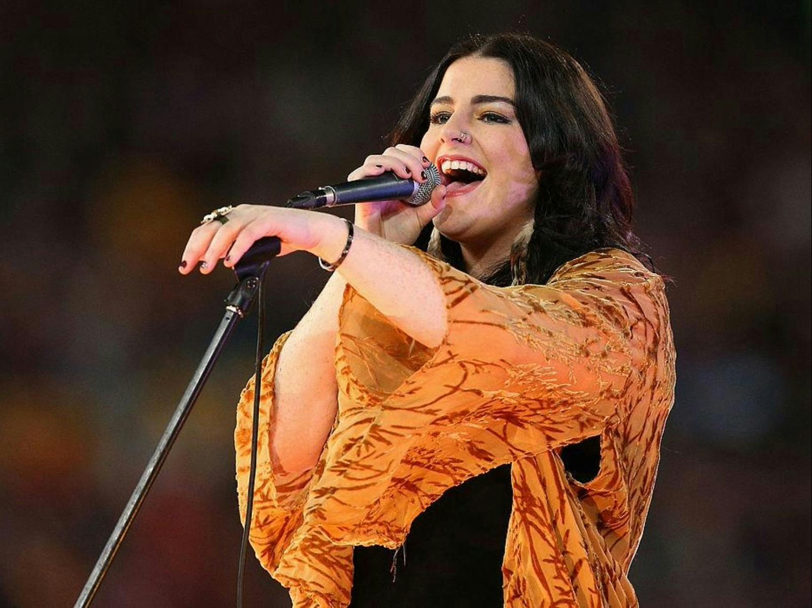 woman singing on stage