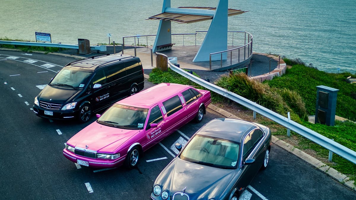 Aerial shot of 3 Luxury Passenger Vehicles at Wreck Point, as a dramatic dawn breaks over Keppel Bay