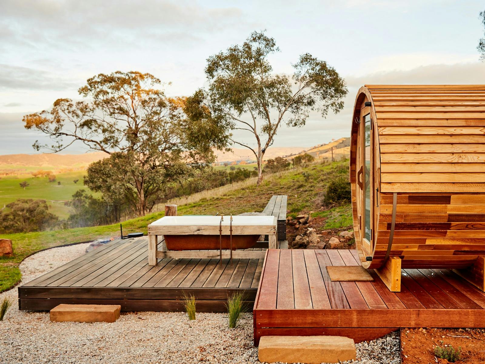 Western red cedar steam sauna and original cast-iron tub take in the view