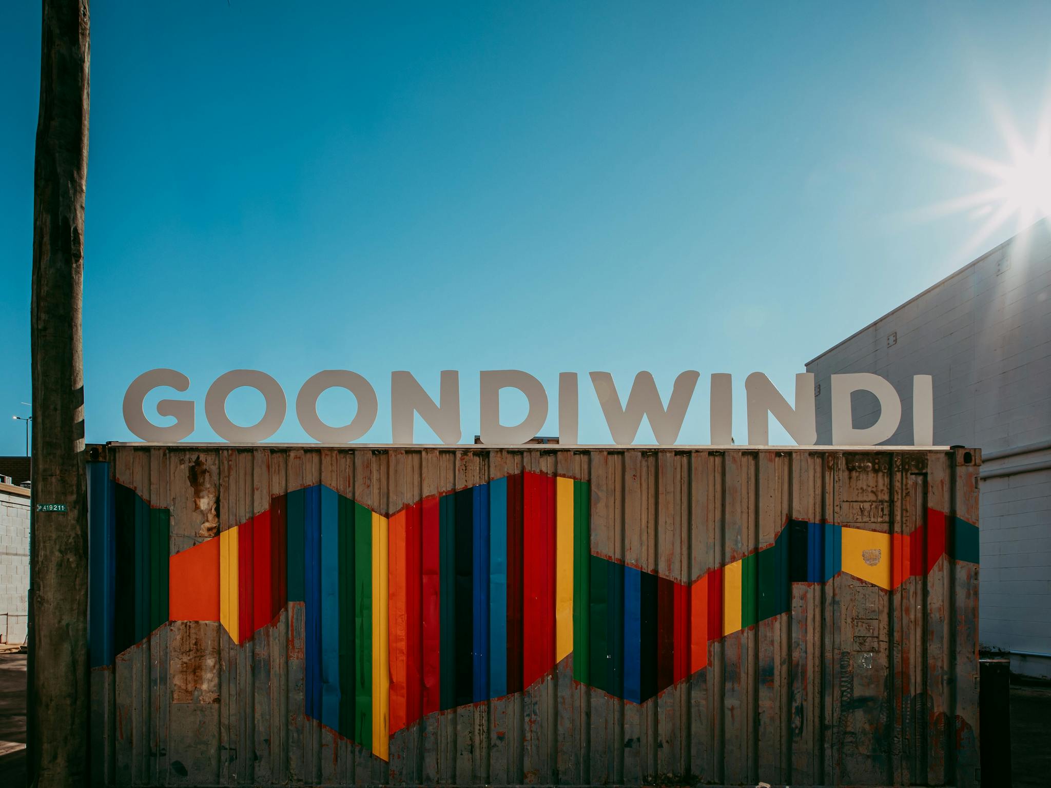 Photo of Large Goondiwindi Sign with rainbow art Photo of Large Goondiwindi Sign with rainbow art