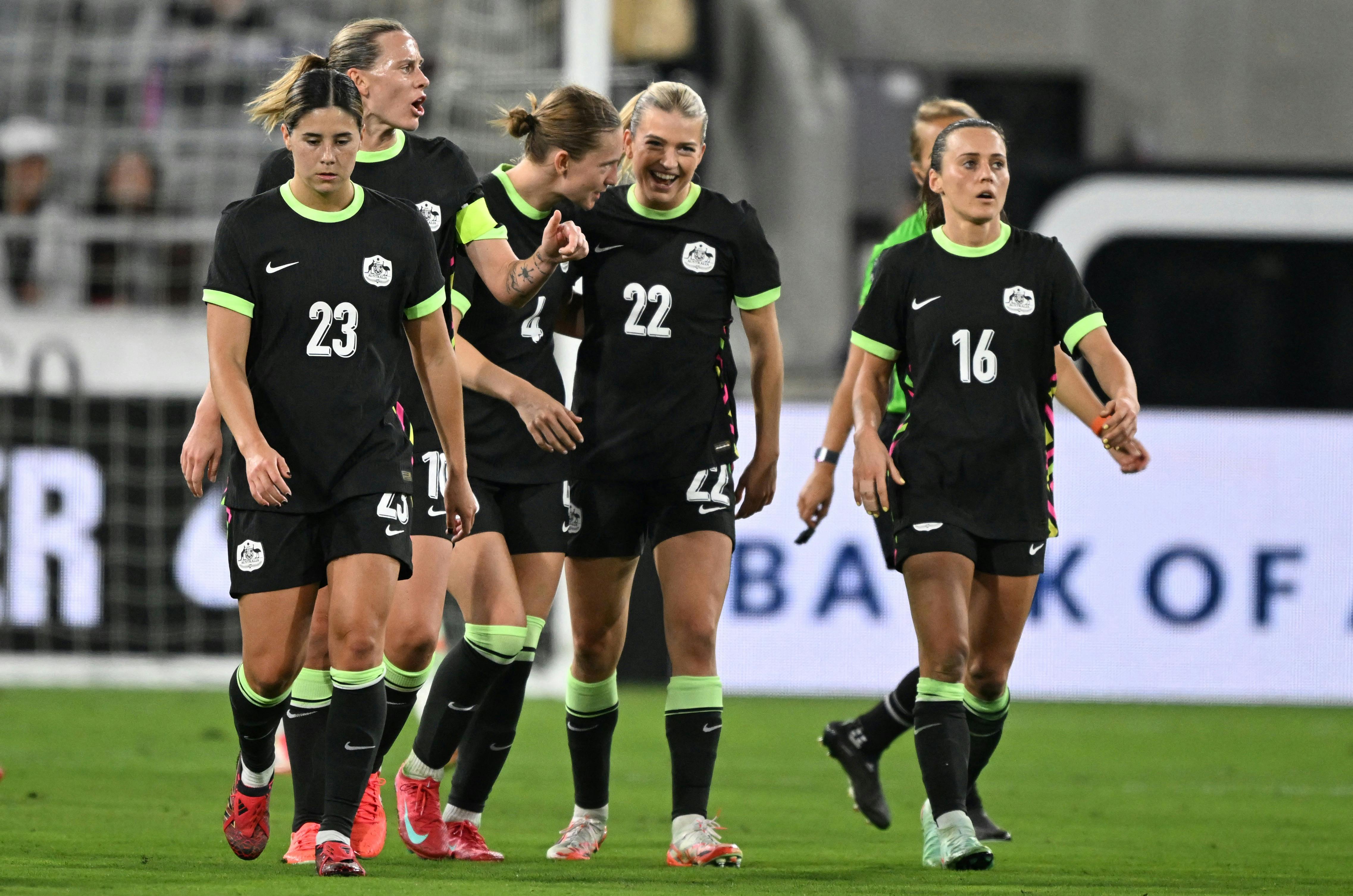 Australia's forward #16 Hayley Raso celebrates scoring her team's first goal