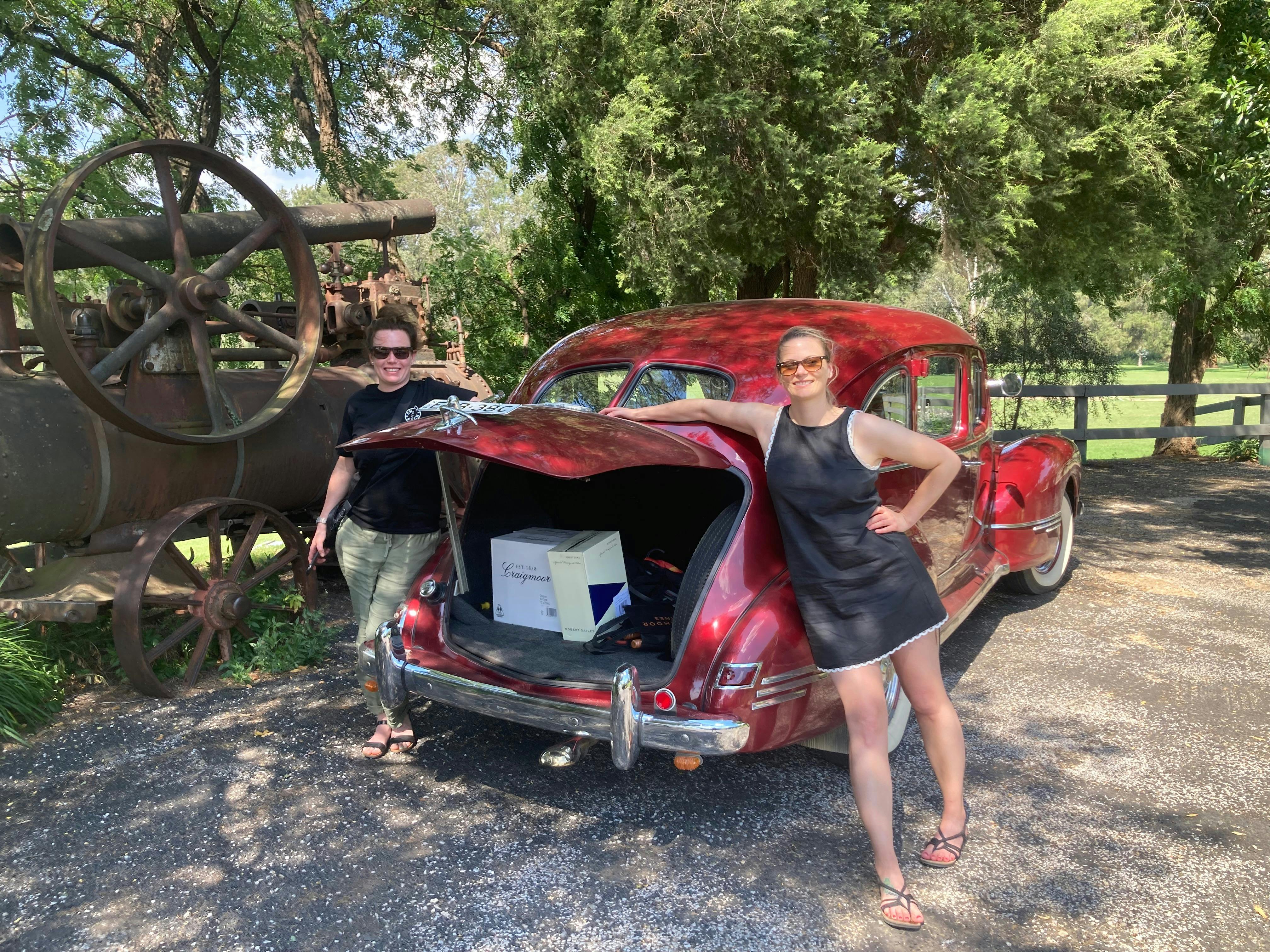 Boot open in the red Hudson displaying wine purchases
