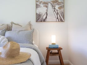 Queen bed, linen Robe, Grampian Goods Co lotion