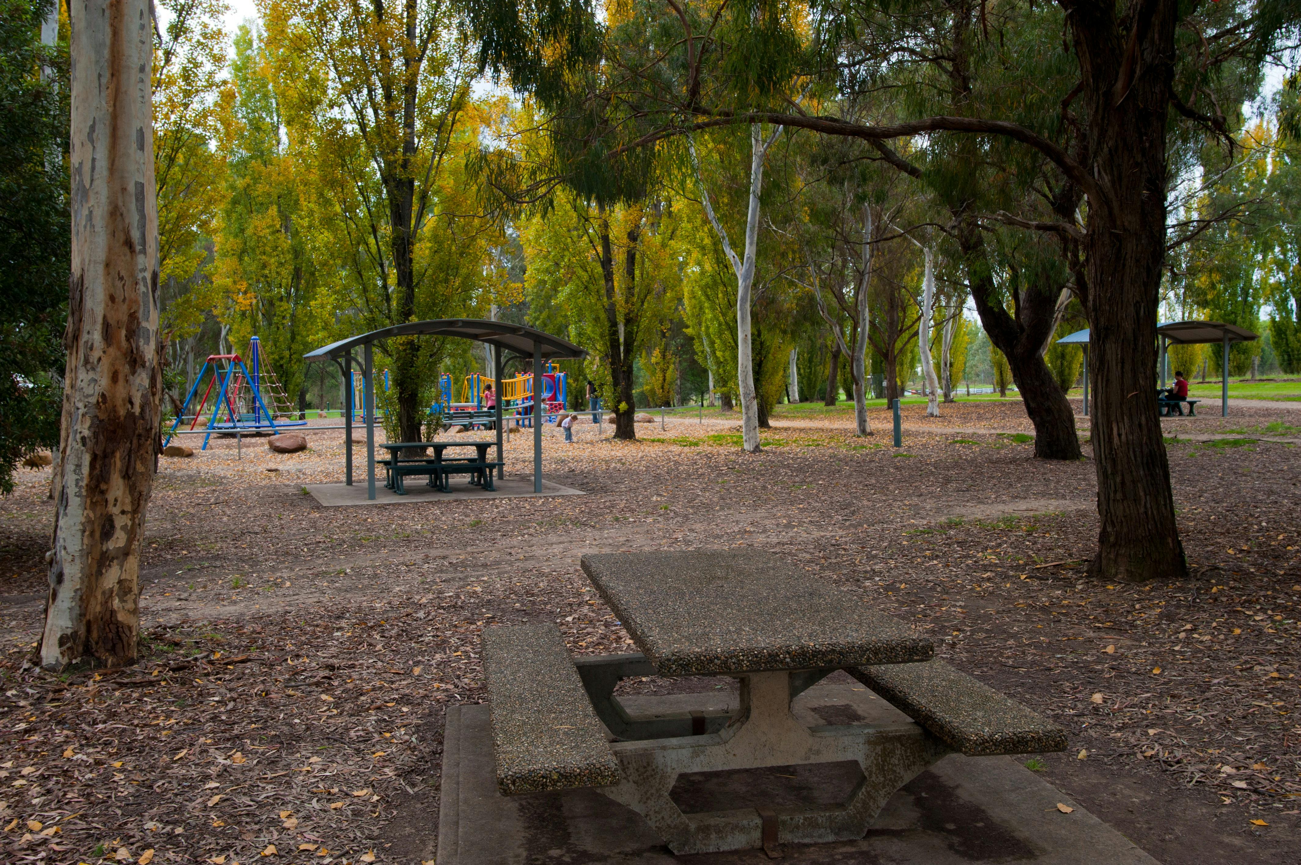 Tables and chairs near the children's playground