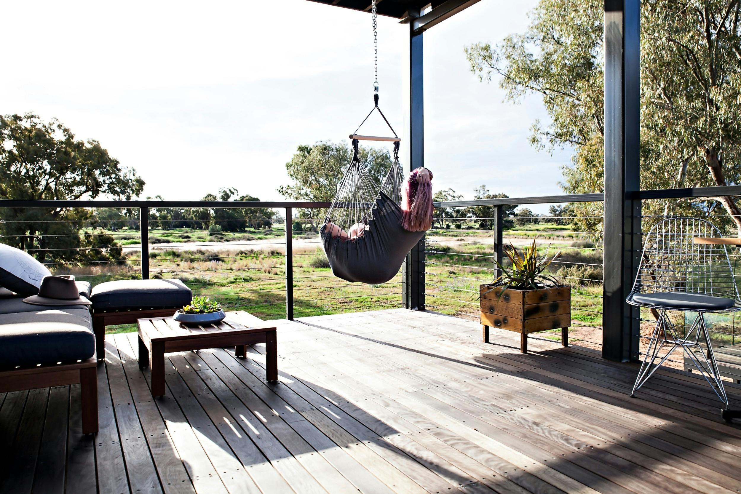 guest in hanging chair