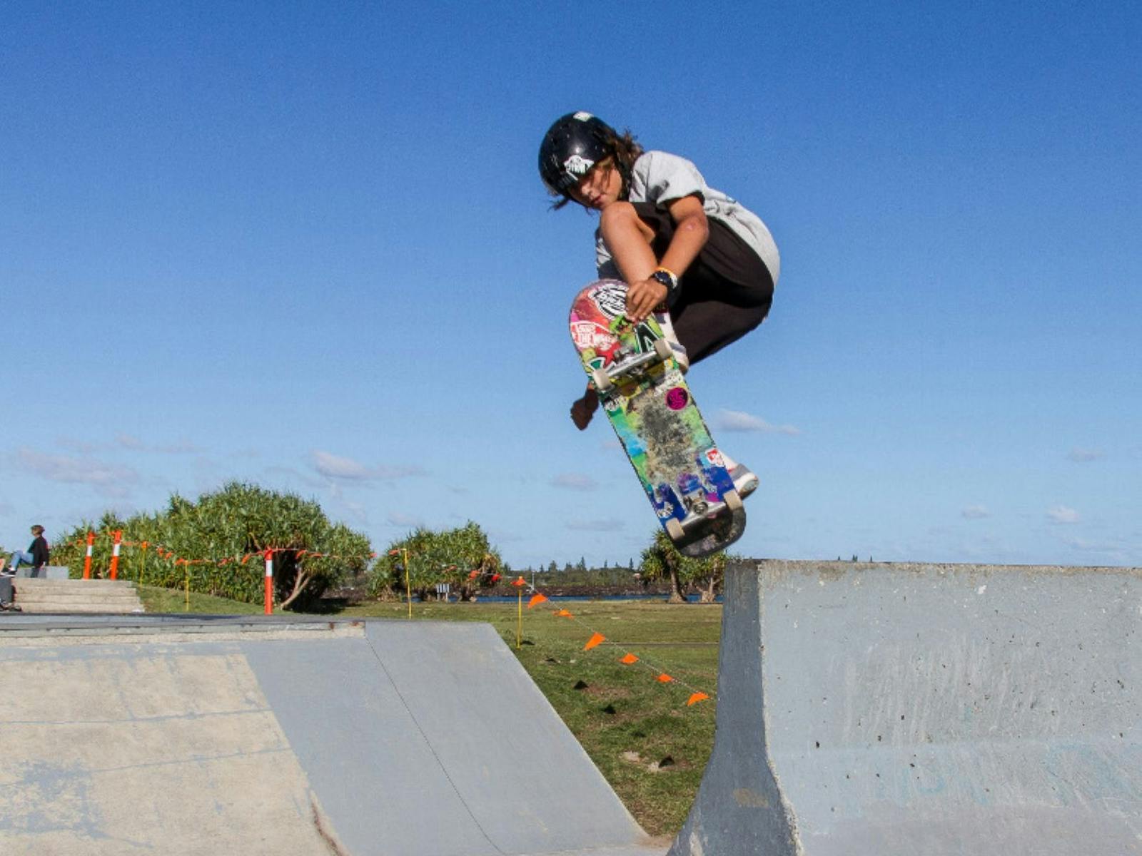 A child skating on a board at the skatepark