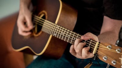 Man playing acoustic guitar