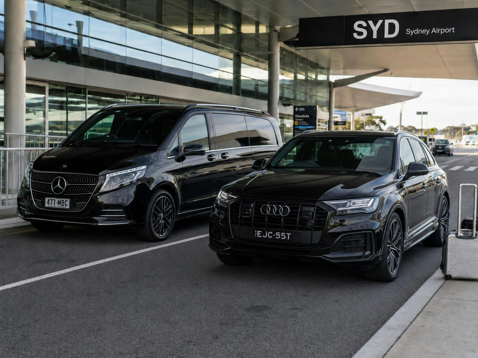 Black Mercedes-Benz V-Class and Audi SUV providing private chauffeur transfers at Sydney Airport