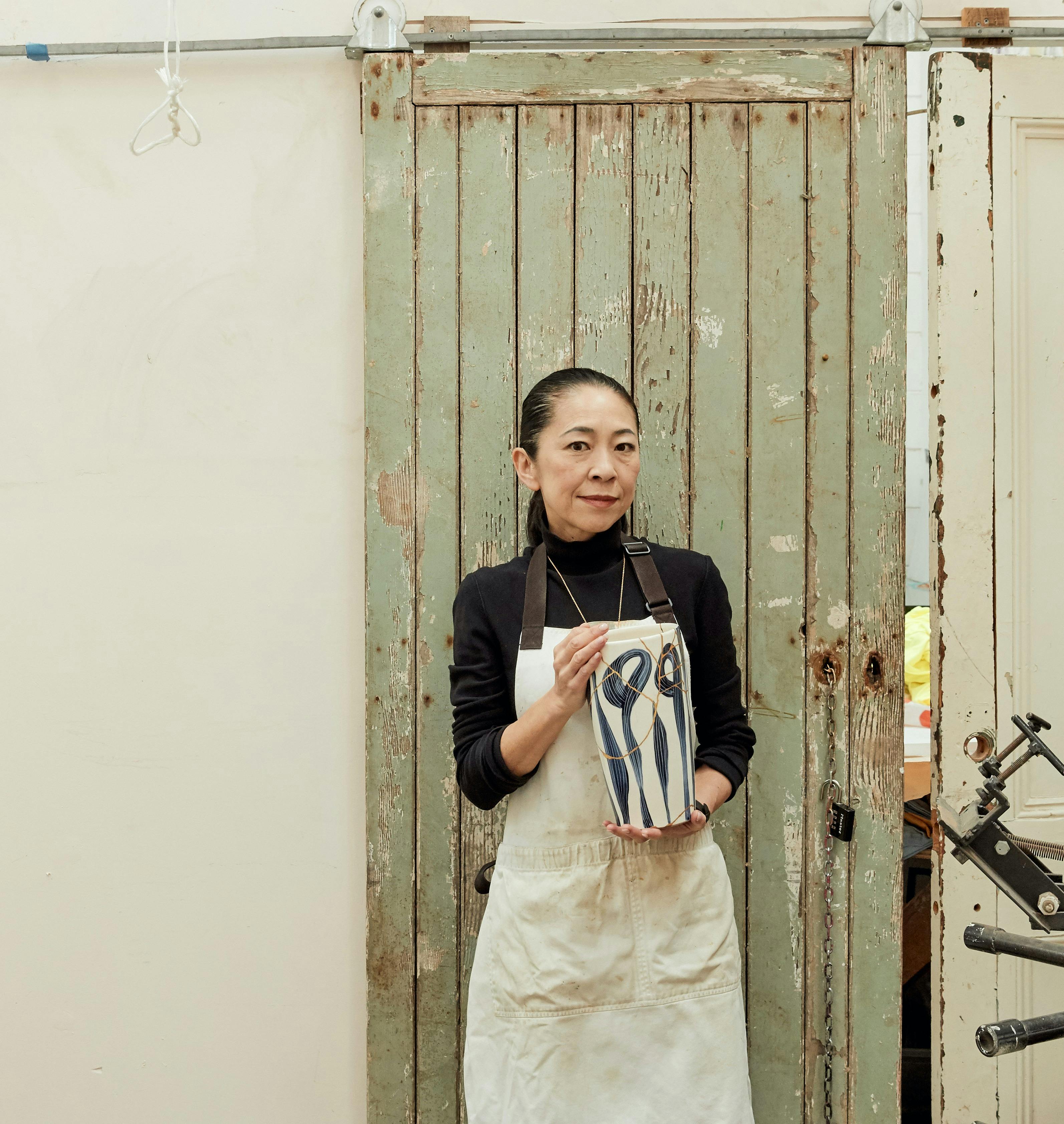 Yoko Kawada holding a Kinsugi pot