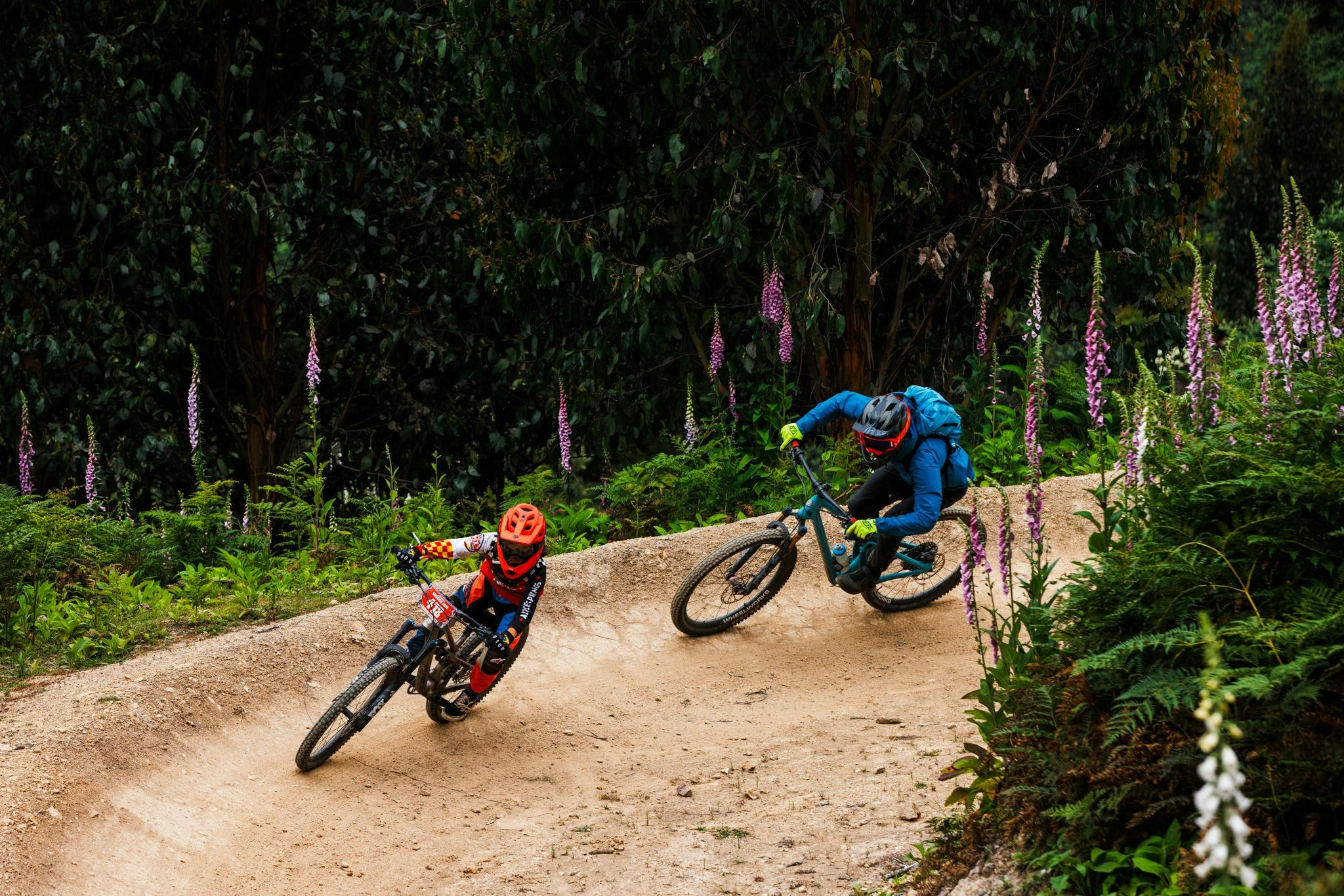 Riders at Maydena Bike Park in beginner racing segments