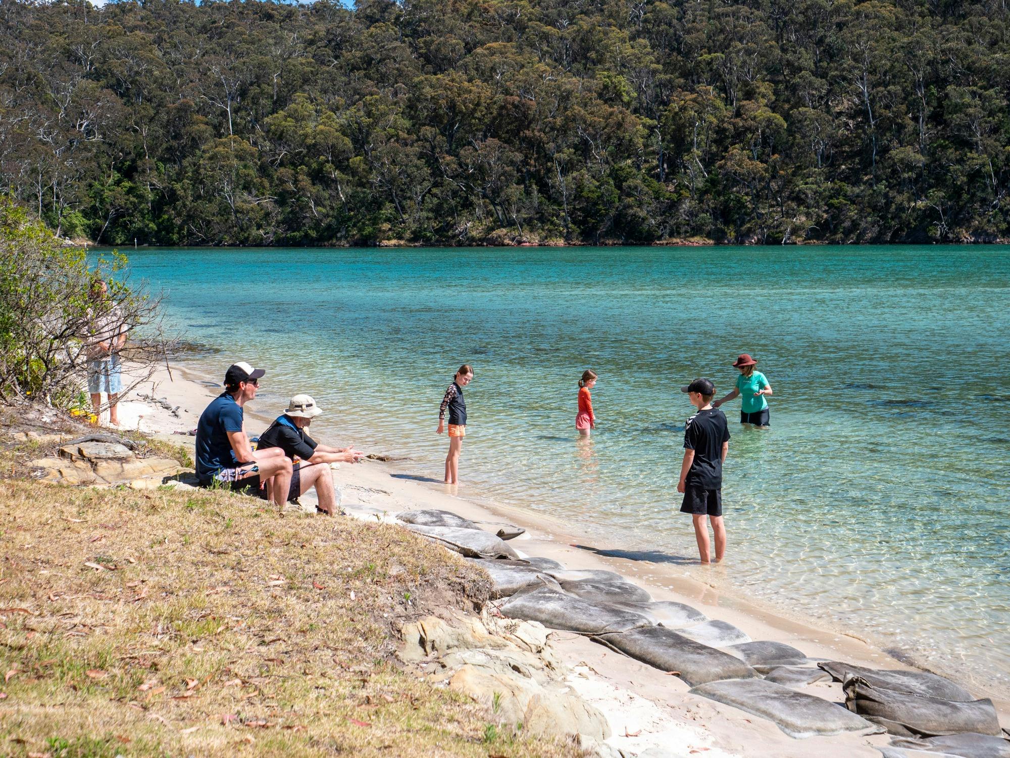 Guests enjoying swiming at remote beach