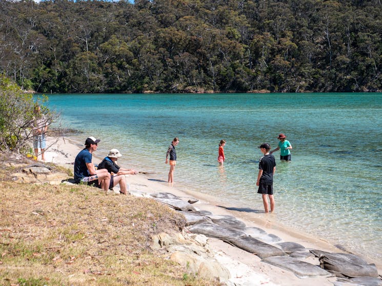 Guests enjoying swiming at remote beach