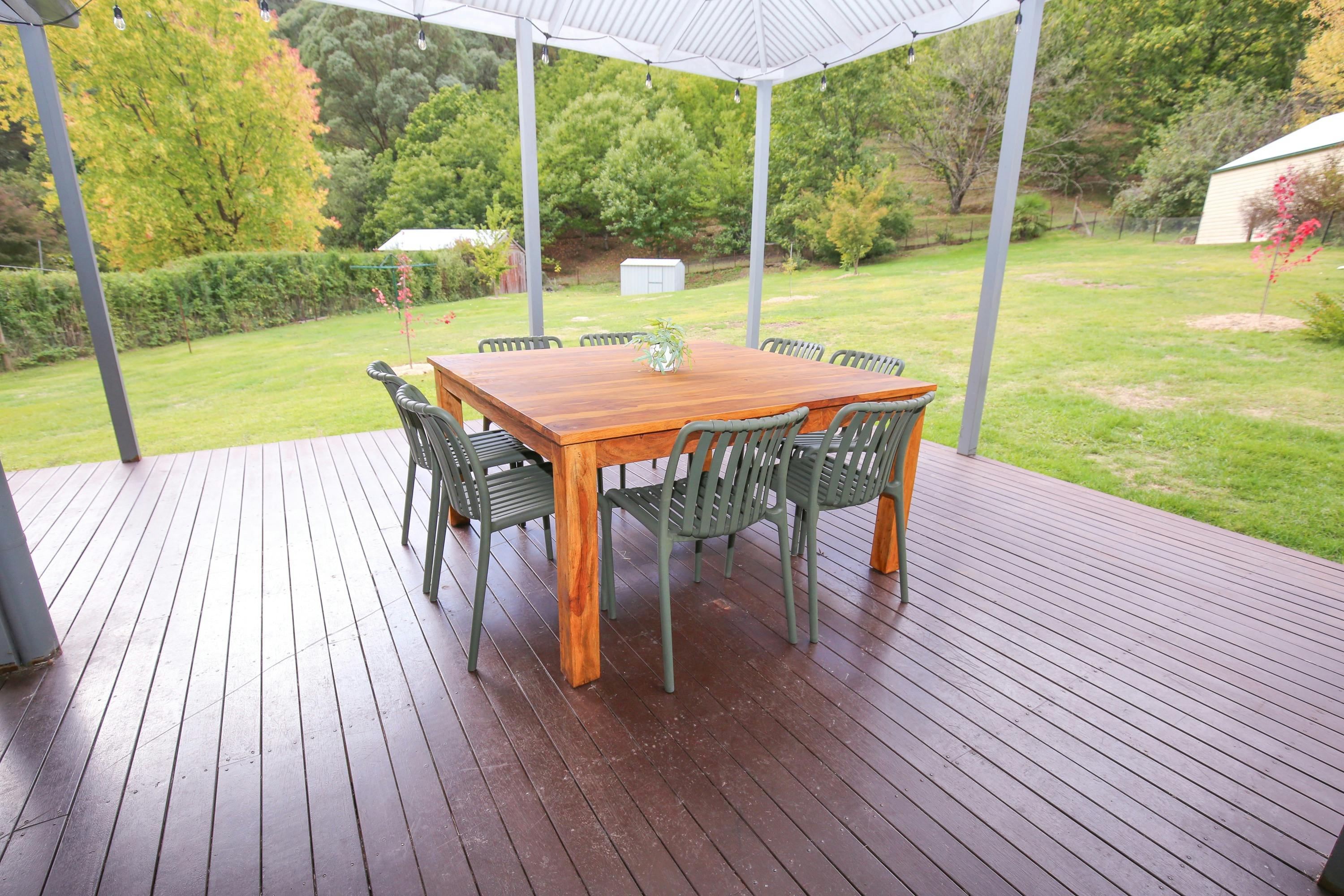 Alfresco area with seating overlooking the backyard