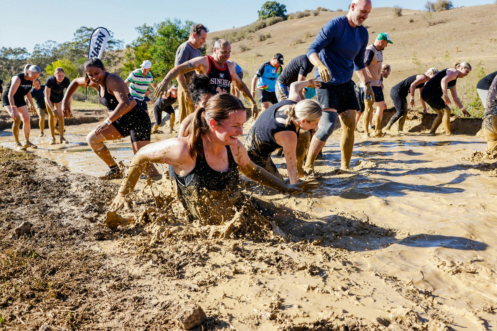 Racer running through a mud flat