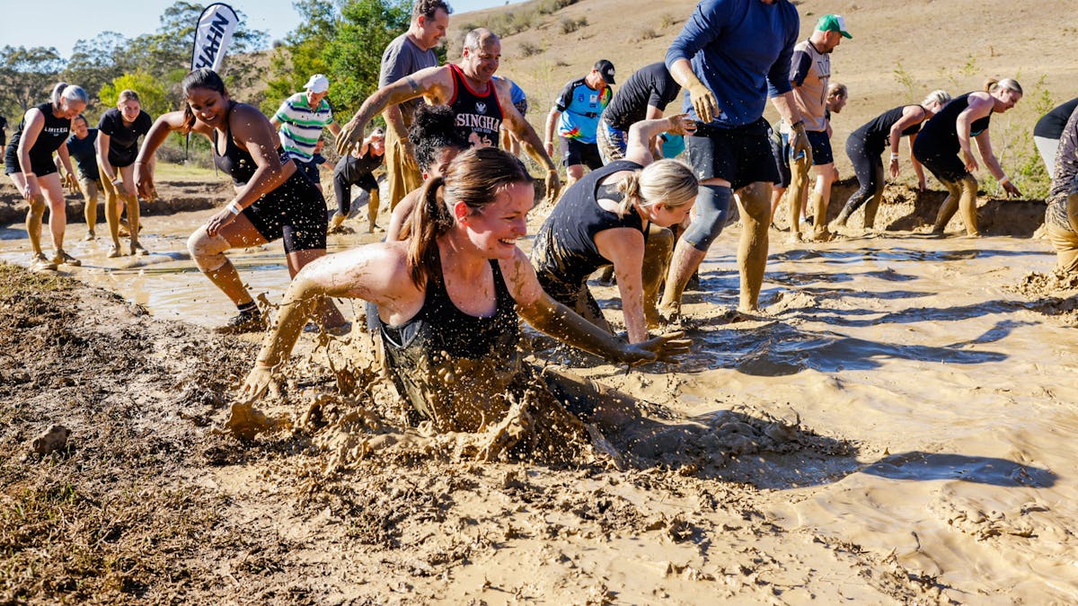 Racer running through a mud flat