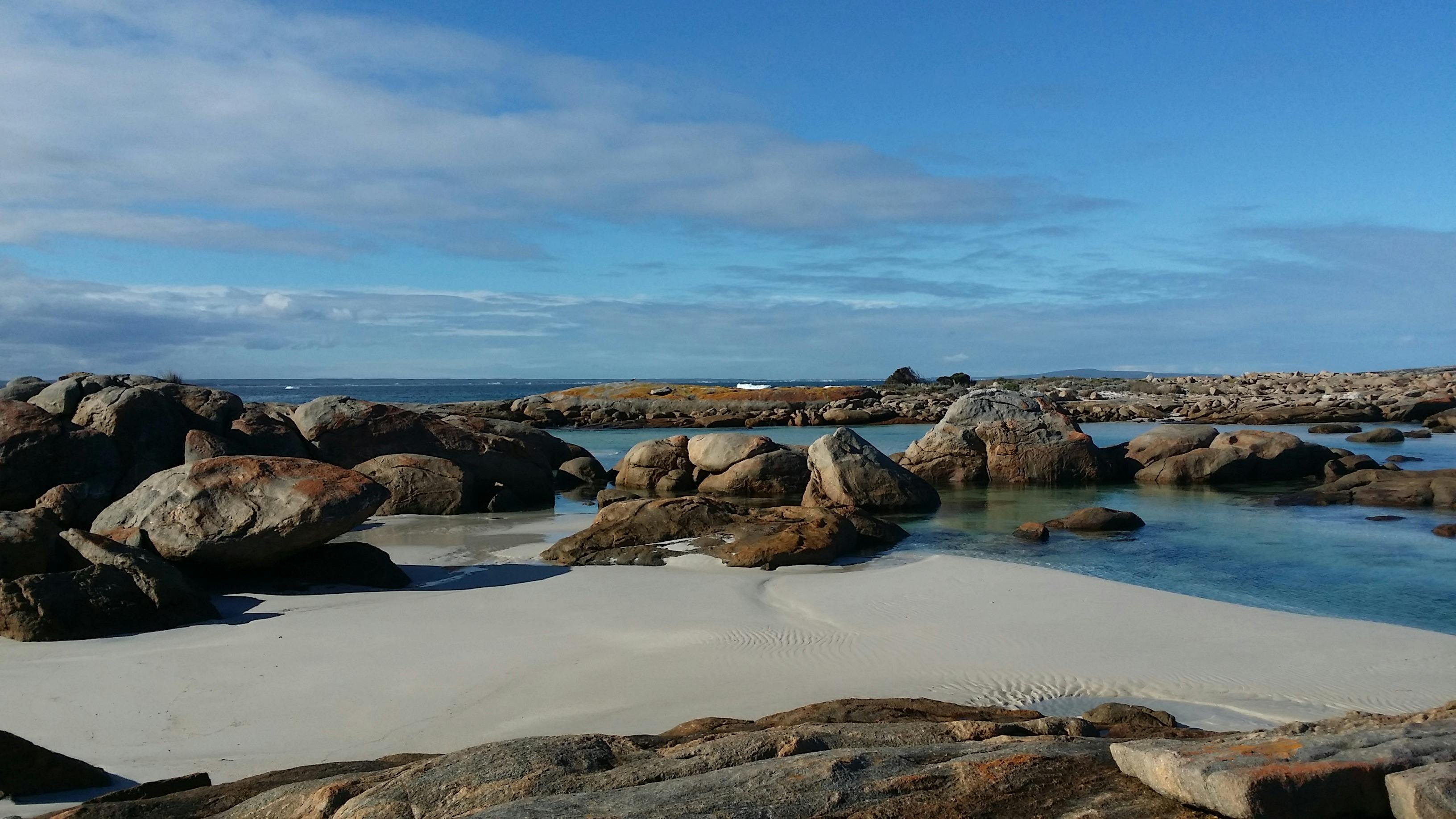 Beach with large boulders.