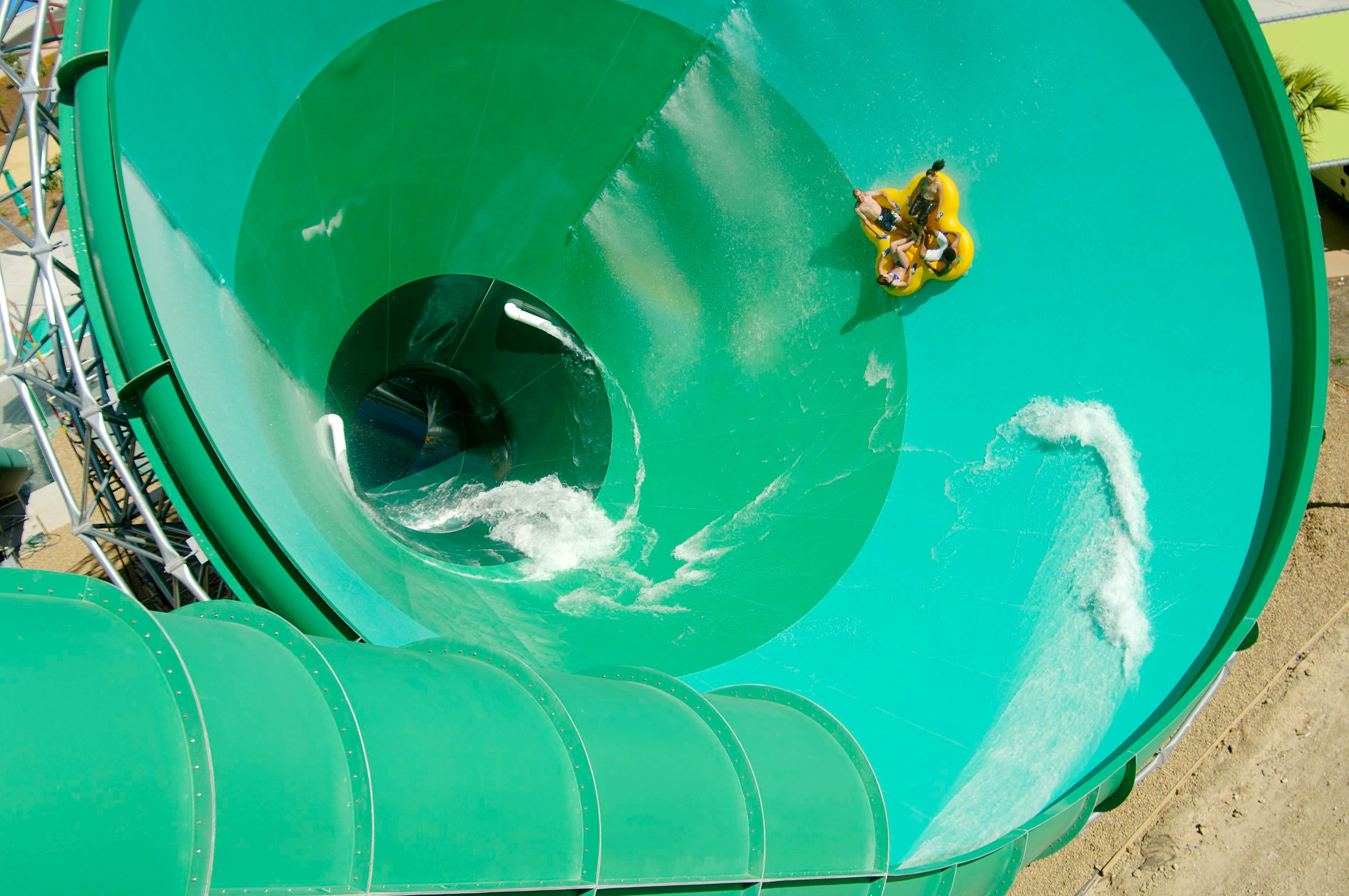 Group of guests on tube sliding on The Green Room water slide