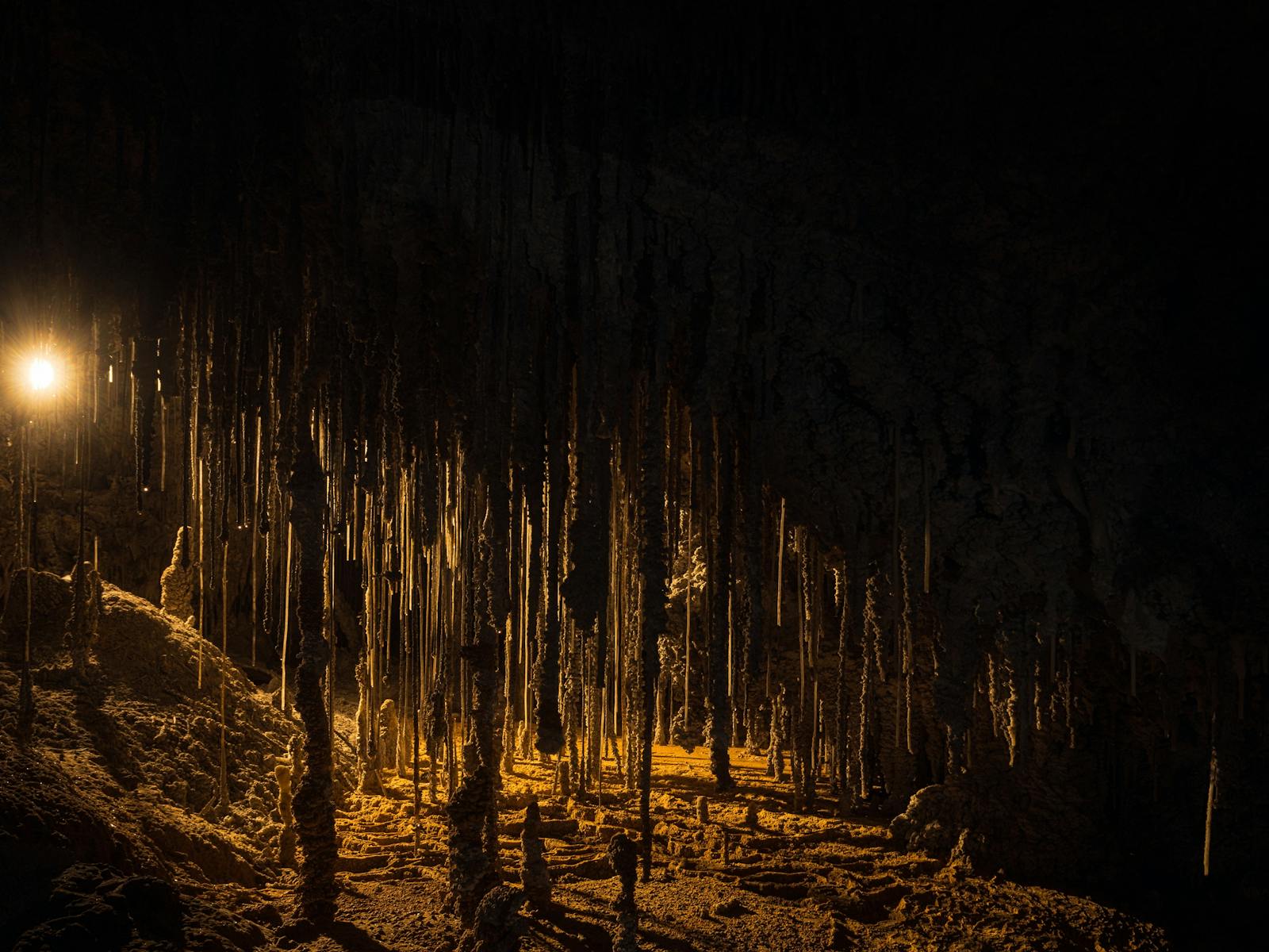 Cave formations illuminated by light