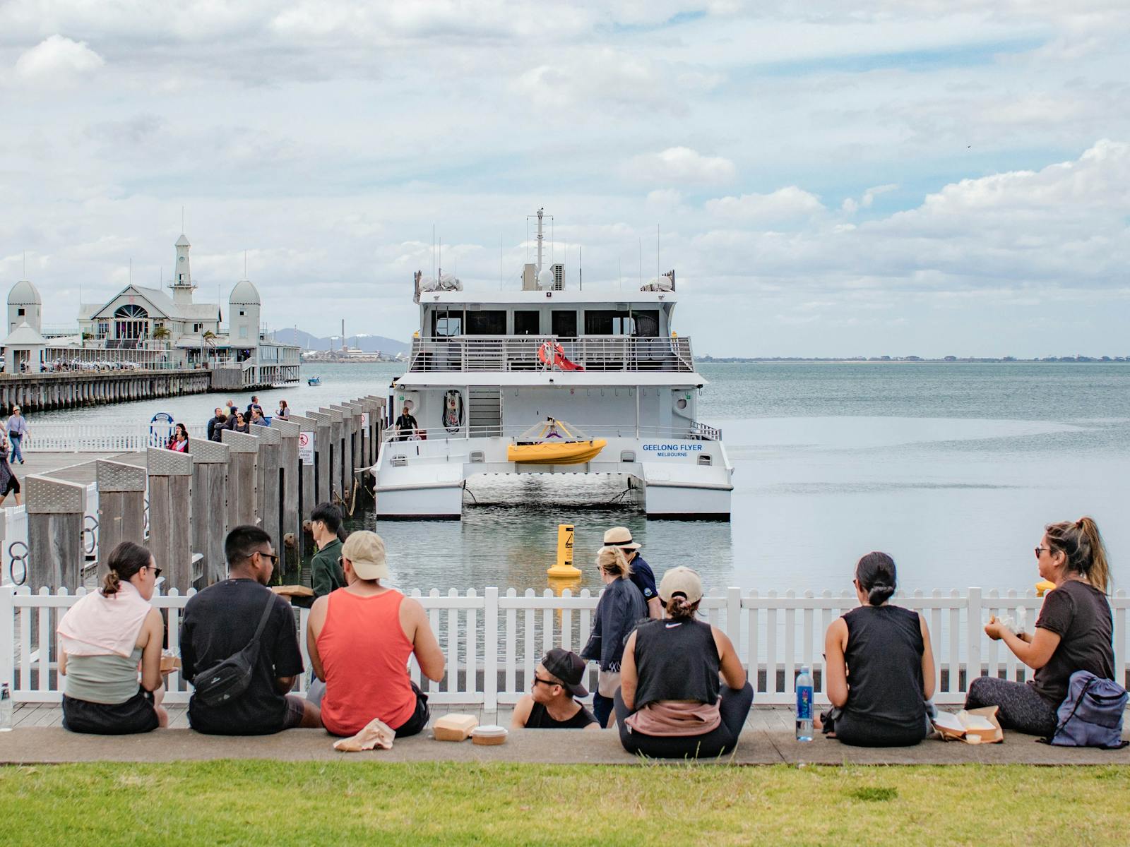 Passengers enjoying Geelong’s waterfront with ferry Geelong Flyer in the background