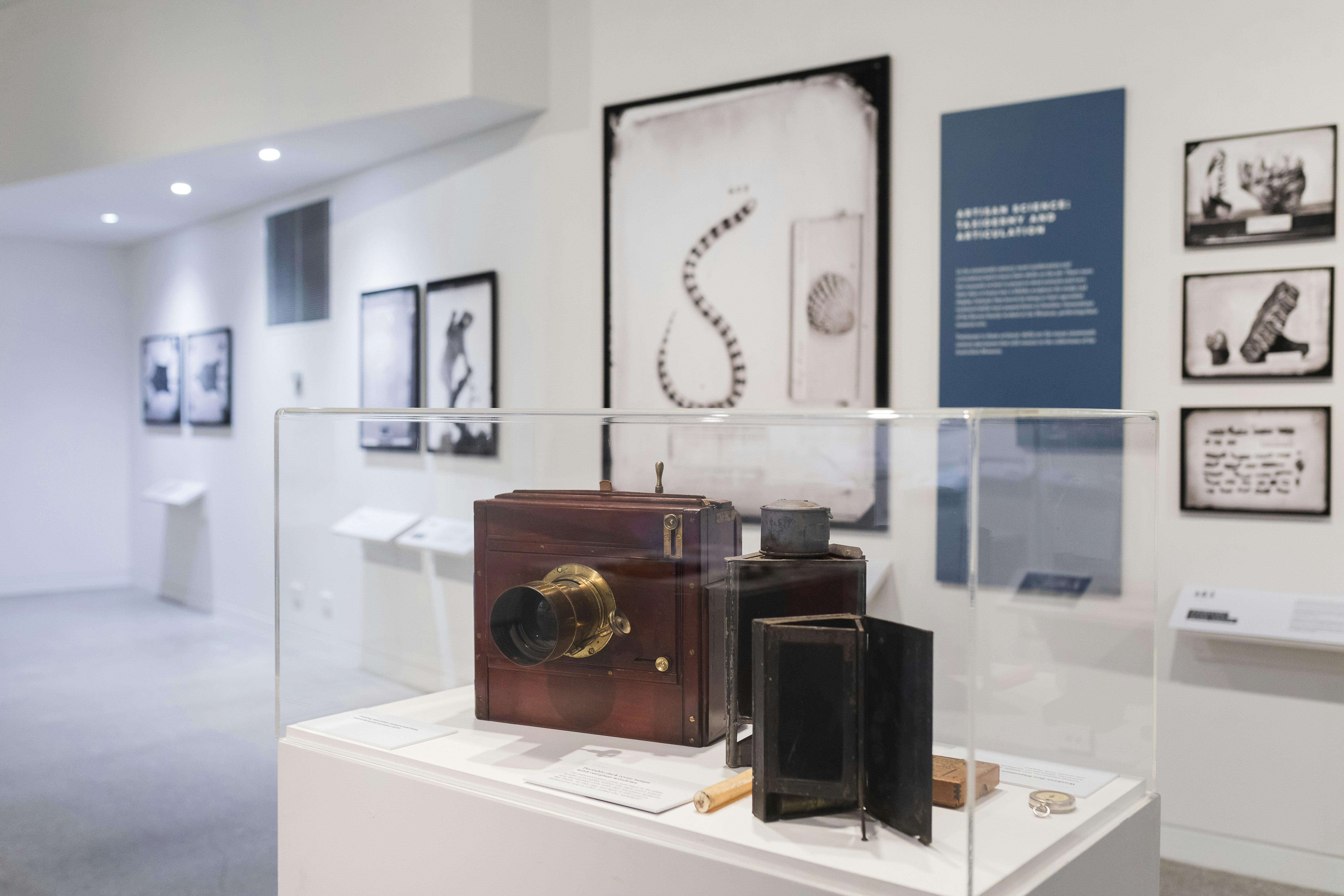 Old photography equipment in glass display case