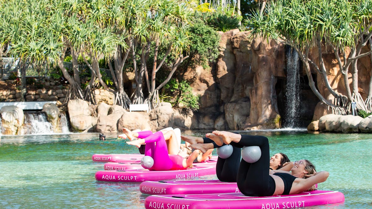 Classical mat pilates exercises taking place on the Aqua Sculpt boards with Pilates balls